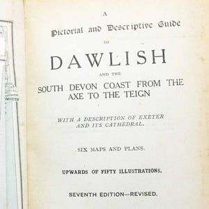 May include: Open book titled "A Pictorial and Descriptive Guide to Dawlish and the South Devon Coast". The book has a map and illustrations. Published by Ward, Lock and Co., Limited. Seventh Edition-Revised.