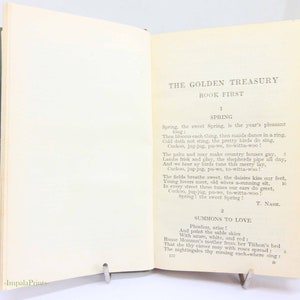 May include: An open book titled "THE GOLDEN TREASURY" with the text "BOOK FIRST" visible. The pages contain a poem about spring, with the author's name, T. Nash, at the bottom. A metal book stand holds the book open.