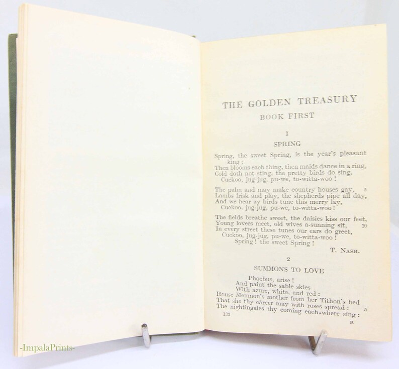 May include: An open book titled "THE GOLDEN TREASURY" with the text "BOOK FIRST" visible. The pages contain a poem about spring, with the author's name, T. Nash, at the bottom. A metal book stand holds the book open.