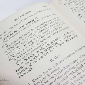May include: A close-up of a page from a vintage book about the properties of rubber. The text discusses the waterproof nature of rubber and its elasticity. The text also mentions that rubber is flammable, insoluble in water, but soluble in turpentine or naphtha.