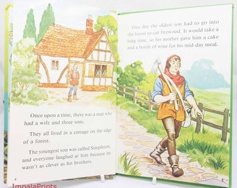 May include: Illustration from an open book with text. The left page shows a cottage and a man. The right page depicts a man walking with a tool. Text includes "Once upon a time..." and "One day the oldest son..." The book is from ImpalaPrints.