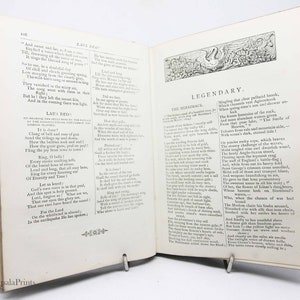 May include: An open book with a vintage design. The pages feature text about the Merrimack River and a poem titled "Laus Deo!" The book is open to a page with a decorative illustration of a swan.