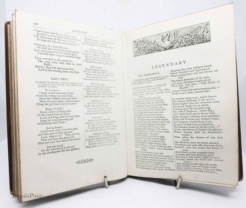 May include: An open book with a vintage design. The pages feature text about the Merrimack River and a poem titled "Laus Deo!" The book is open to a page with a decorative illustration of a swan.
