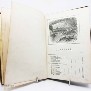 May include: A black and white illustration of a river scene with a bridge and trees. The text "CONTENTS" is printed in black at the bottom of the page.