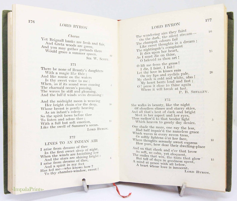 May include: An open book displaying poetry by Lord Byron, pages 176 and 177. The book has a green cloth cover and a metal page holder. The text is printed in black ink on cream-coloured paper.