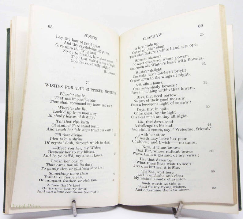 May include: An open book with poetry on display. The left page shows the poem "Jonson" and the right page shows the poem "Crashaw". A metal clip holds the book open.