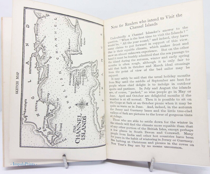 May include: Open book with a sketch map of the Channel Islands on the left page and text on the right. The map is in black and white, with the words "Sketch Map" printed on the left side.