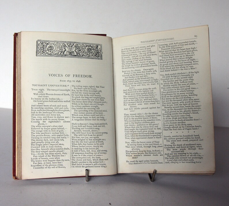 May include: A page from a book titled "Voices of Freedom" with a black and white illustration of a tree with a bird on a branch. The text on the page is about Toussaint L'Ouverture, a Haitian revolutionary leader.