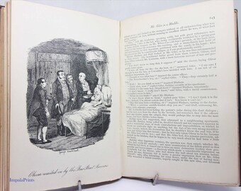 Oliver Twist, edizione vintage con copertina rigida degli anni '20, blu e illustrata, romanzo classico di Charles Dickens.