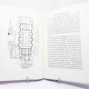 May include: A black and white illustration of the floor plan of the Roman Baths in Bath, England. The illustration shows the layout of the various rooms, including the Great Bath, the Spring Room, and the various other rooms. The text "Great Bath" is visible in the illustration.