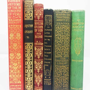 May include: A collection of six vintage hardback books with decorative spines in red, black, dark red, navy, and green. The titles include History of the Conquest of Peru, Christmas Stories, Familiar Studies of Men and Books, Plutarch's Lives, Headlong Hall, and An Edgbaston Book of Poetry.