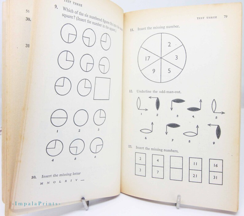 May include: Open book with pages featuring math and logic puzzles. The left page has questions about shapes and missing letters. The right page includes number sequences and an odd-one-out exercise. The text "TEST THREE" is visible at the top of the pages.