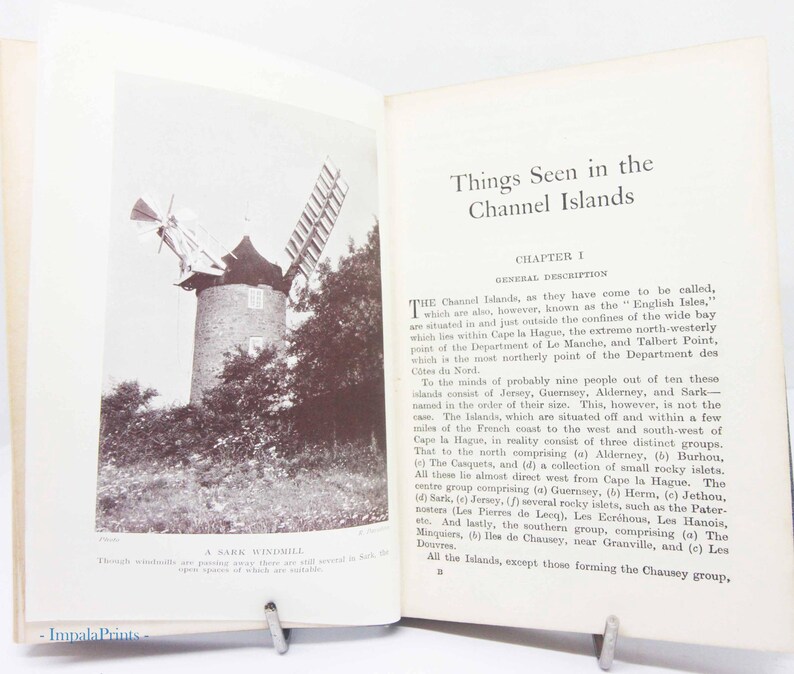 May include: An open book with the title "Things Seen in the Channel Islands" and a black and white photo of a windmill. The text below the photo reads "A Sark Windmill". The book is open to Chapter 1.