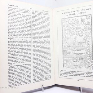 May include: Open book with a diagram titled "A Good Way to Lay Out a Small Garden." The illustration shows a garden layout with paths, flower beds, and labeled features like a lawn and fruit trees.