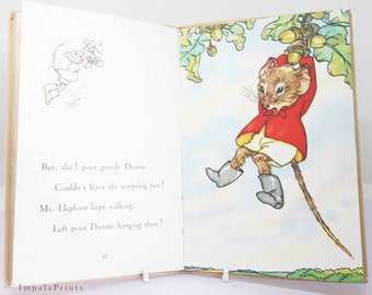 May include: An illustration from a children's book showing a mouse hanging from a tree branch by its tail. The mouse is wearing a red jacket and white trousers. The text on the page reads: "But, alas! poor greedy Dannie Couldn't leave the tempting fare! Mr. Elephant kept walking, Left poor Dannie hanging there!"