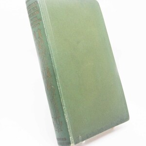 May include: A vintage green hardcover book, titled "Palgrave's Golden Treasury with Additional Poems". The spine displays gold lettering and decorative patterns, with "Oxford" at the base. A red ribbon bookmark is visible, indicating the page.