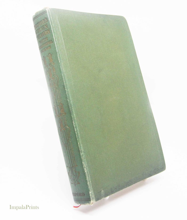 May include: A vintage green hardcover book, titled "Palgrave's Golden Treasury with Additional Poems". The spine displays gold lettering and decorative patterns, with "Oxford" at the base. A red ribbon bookmark is visible, indicating the page.
