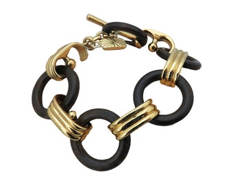 Originele Yves Saint Laurent (YSL) Paris France zeer mooie vintage schakelarmband met hout ontworpen door Robert Goossens, jaren 80.