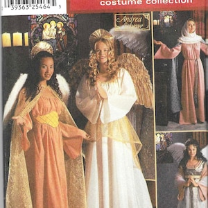 May include: Simplicity Holiday costume collection pattern featuring angel costumes. The image shows several models wearing different angel costumes with wings, halos, and flowing gowns. The pattern includes sizes BB, L, and XL.
