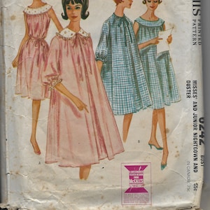 May include: A vintage sewing pattern for a nightgown and duster. The pattern is for misses' and juniors' sizes and features a bust measurement of 32 inches. The pattern is printed on white paper with a pink and blue color scheme.