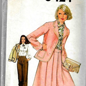 May include: Simplicity sewing pattern number 8424 for a pink jacket and skirt. The pattern is for size 10 miss.