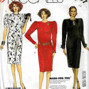 May include: A sewing pattern for a dress with three different styles. The pattern is for sizes 14 and features built-in fit adjustments. The pattern includes darts for C and D cups. The pattern is called "Made-For-You".