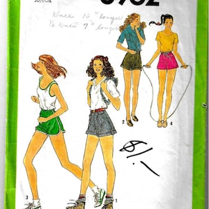 May include: A sewing pattern for shorts, Simplicity pattern number 8962, for juniors, size 11, waist 25 1/2 inches. The pattern includes instructions for making shorts that are knee length or shorter. The pattern is illustrated with three women wearing different styles of shorts.