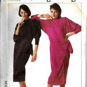 May include: Simplicity sewing pattern number 7683 for a dress. The pattern includes two different styles, one in black and one in pink. The pattern is for size 12, European size 40. The pattern is designed by Jackie Rogers.