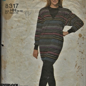 May include: A vintage sewing pattern for a striped tunic sweater with a V-neck. The pattern is for sizes 6-12 and is called "Super Saver" with the number 8317.