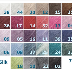 May include: A color chart for DROPS Kid-Silk yarn, a blend of 75% mohair and 25% silk. The chart shows 43 different colors, ranging from light to dark, with numbers corresponding to each color.
