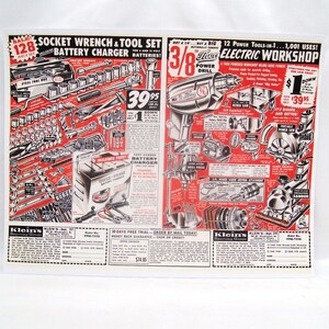 May include: A vintage black and white advertisement featuring a 128-piece socket wrench and tool set with a battery charger on the left, and a 3/8 inch electric workshop power drill with various attachments on the right, including order forms at the bottom.