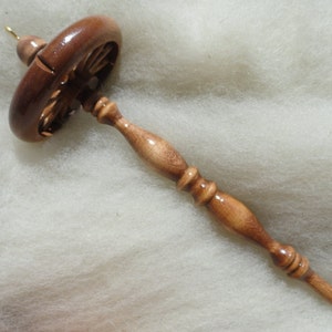 top whorl drop spindle with cherry finish, 3.5" spoked whorl with notch for yarn, 10" long, 2.4 oz. with brass hook