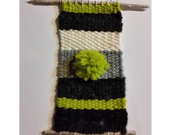 Lime green, black and grey woven wall hanging
