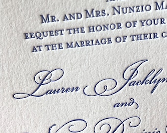 May include: Wedding invitation with a formal announcement of the marriage of Lauren and Nunzio. The names are written in elegant cursive script.