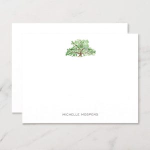 May include: White stationery with a watercolor illustration of a tree. The tree has green leaves and a brown trunk. The text "MICHELLE MOSPENS" is printed in black at the bottom of the card.
