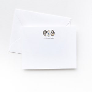 May include: White stationery card with a watercolor illustration of three oyster shells in shades of gray, white, and yellow. The text "Blake Stein" is printed in gray below the illustration.