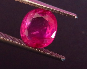 0.98 Ct. I.G.I. Certified unheated Ruby. Antique neon pinkish red classic glowing Burmese Ruby from the legendary mine.  Watch video.