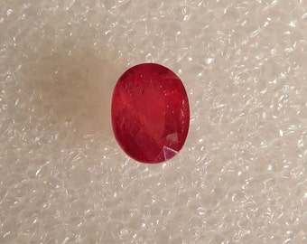 2.96 Ct. Vivid red natural Ruby. In perfect oval cut, top color with fair amount of transparency.