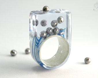 Abstract pearl ring "Pearls drift" with real grey pearls and blue bead cord on a ring covered with metal leaf made of resin