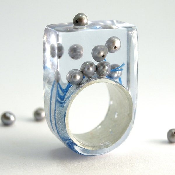 Abstract pearl ring "Pearls drift" with real grey pearls and blue bead cord on a ring covered with metal leaf made of resin