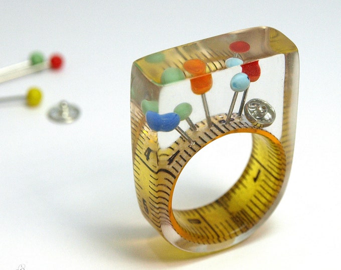 Sewing basket – extraordinary sewing supplies ring with measuring tape, colorful fixing pins & snap fastener on a yellow ring made of resin