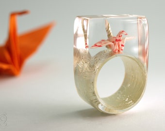 Origami crane ring – shimmy luck – with self-made folded mini-crane made of colored paper on white gold leaf made of resin