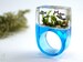 Etsy Design Awards Finalist: Aquarium – Magnificent fish ring with silver ornamental fish, sand, stones & moss on a blue ring made of resin 