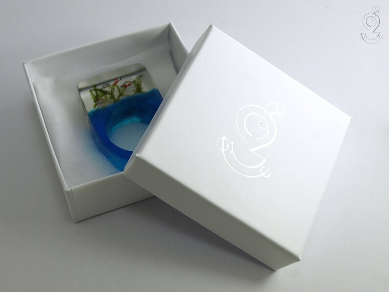 stones /& moss on a blue ring made of resin Etsy Design Awards Finalist Aquarium \u2013 Magnificent fish ring with silver ornamental fish sand