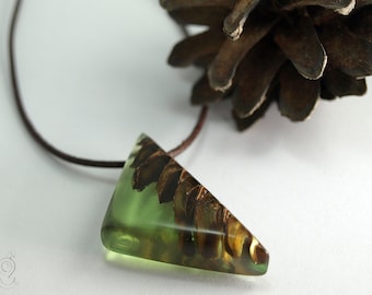 Wood and resin – an unique pinecone pendant with a real brown pinecone in green resin and dark brown leather cord