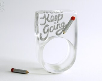 Keep going - Calligraphic resin ring with handlettering and mini pencil