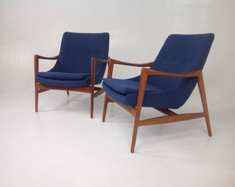 Pair of  Mid century modern lounge chairs in the style of Ib Kofod-Larsen Lounge Chairs