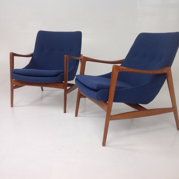 Pair of  Mid century modern lounge chairs in the style of Ib Kofod-Larsen Lounge Chairs