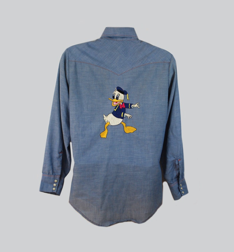 42 chest 1970s vintage donald duck embroidered chambray western shirt 70s novelty disney shirt
