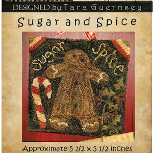 May include: A handcrafted punch needle design titled "Sugar and Spice" featuring a gingerbread man, candy cane, and text. The design is approximately 5.5 x 5.5 inches. The design is by Tara Guernsey.
